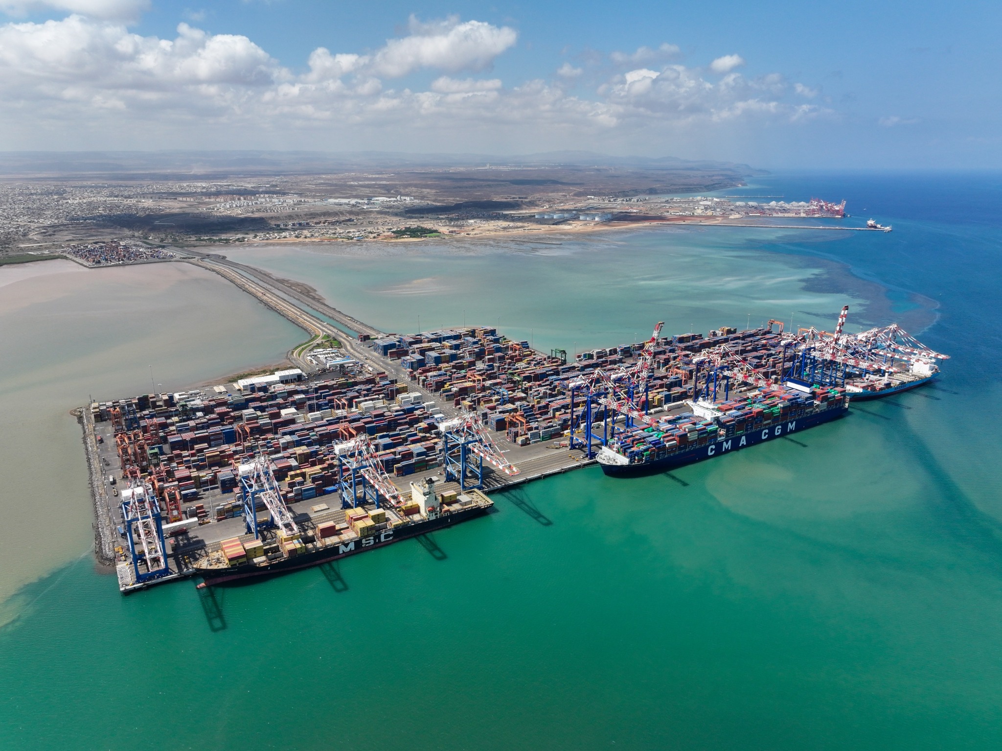 Aerial view of Doraleh container terminal, cranes and vessels along the quay